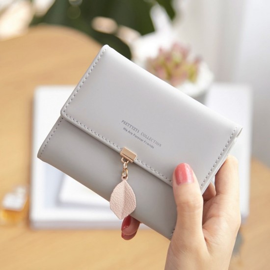 Accordion leaf mini compact card holder for women, simple ultra-thin coin purse with multiple slots and a credit card holder.